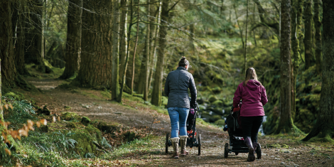 Two mothers with pushchairs in Feshiebridge forest