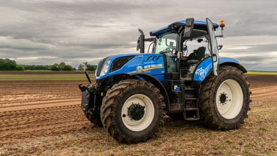 a blue tractor in a field