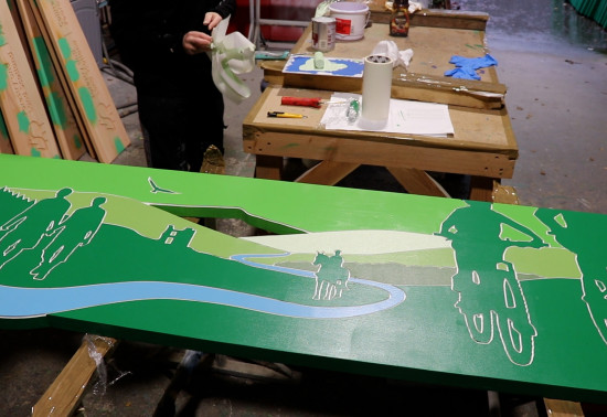 A finished FLS sign painted green