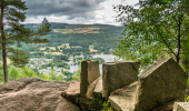 A stoned wall protecting a viewpoint looking over the river Tay with a village on the other side of the river