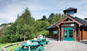 Picnic tables outside a visitor centre building