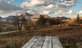 A picnic table overlooking hills