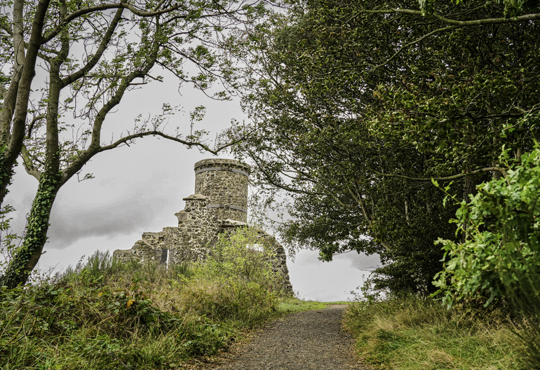 A stone folly on the top of a walk 