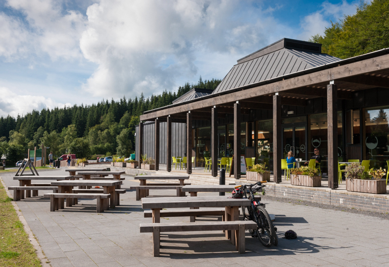 Picnic tables outside a visitor centre building