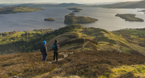 Two hikers in the hills above Balmaha