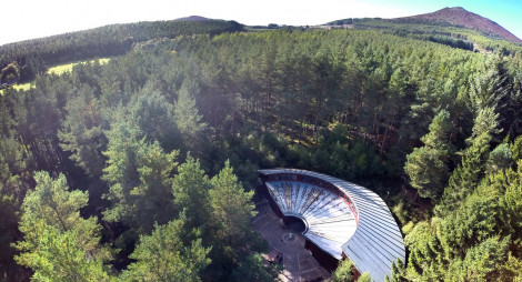 Aerial view of visitor centre and forest at Bennachie