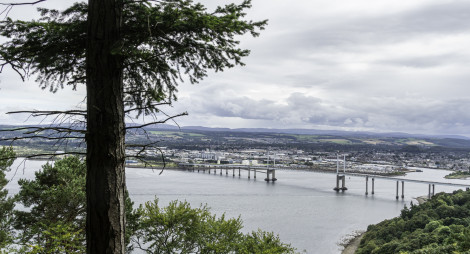 View of Inverness and bridge through trees