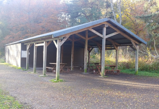 Exterior of the Kinnoull shed, showing a covered outdoor area with attractive timber beams