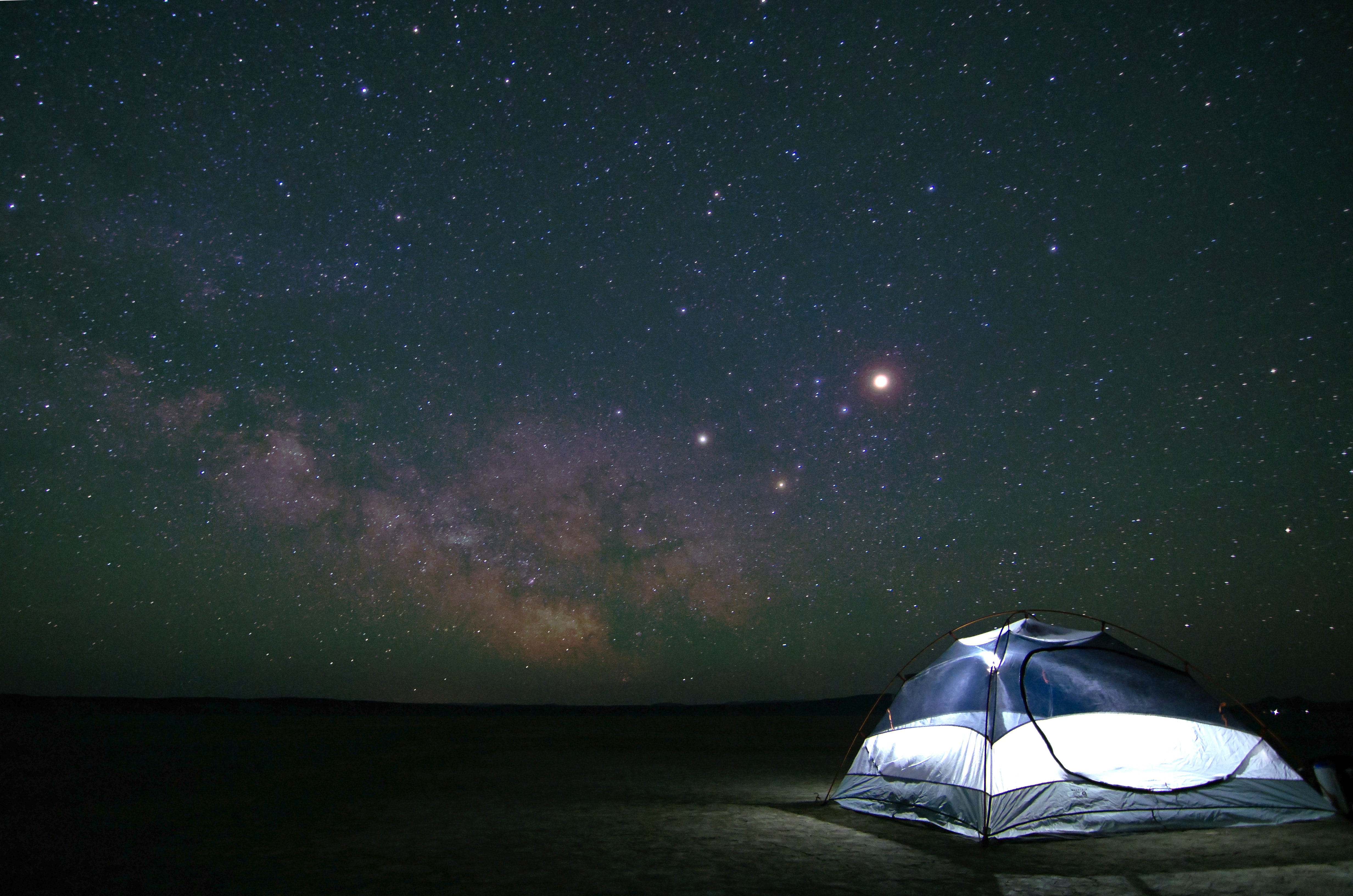 Blue tent under starry sky