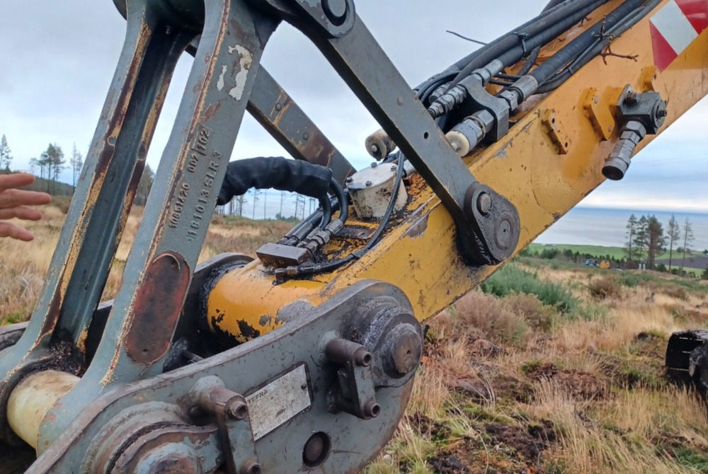 The front of a yellow digger with gps installed