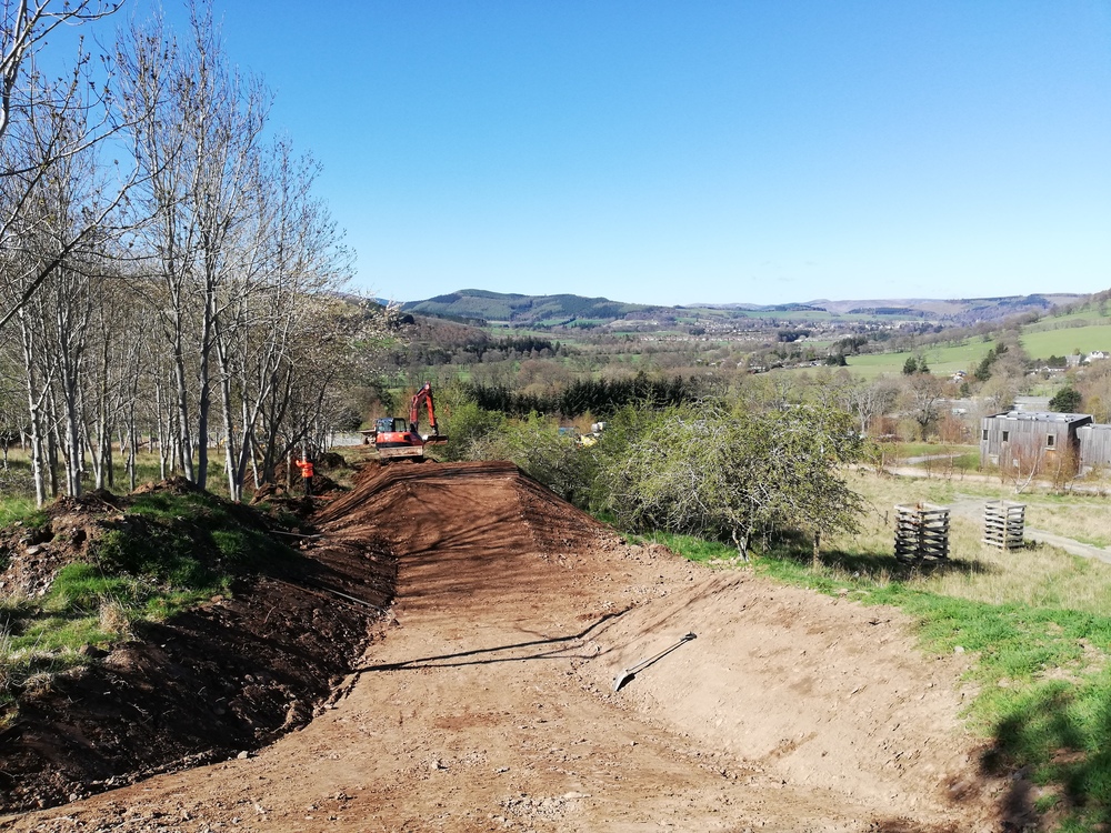 A mountain bike trail under construction on sunny day
