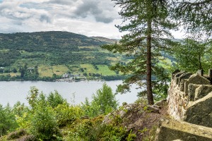  View of river Tay from a stoned view point with a small village on the other hill and trees