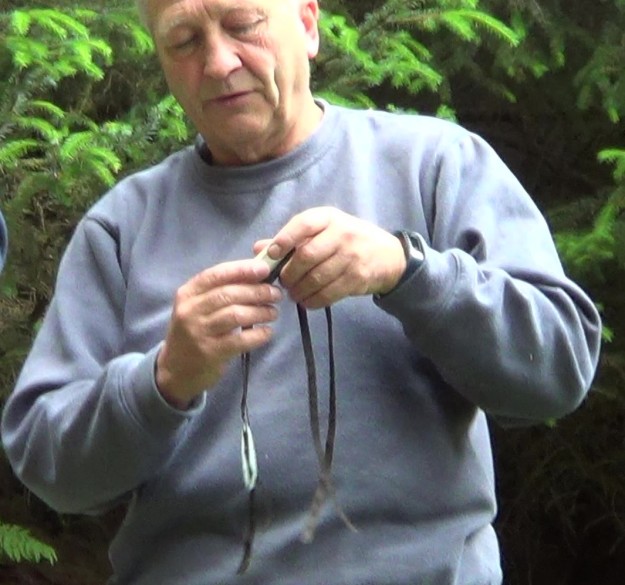 Man holding an electronic osprey tag
