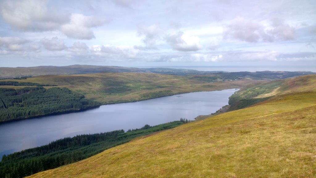 Looking down on to the length of Loch Frisa from the top of a forested hill.