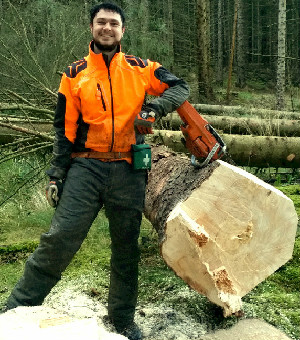 Sean Donaghy standing next to a fallen tree