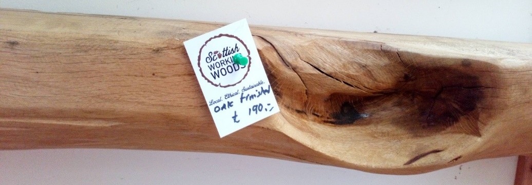 Oak mantle piece with a sign that reads 'local, ethical, sustainable'