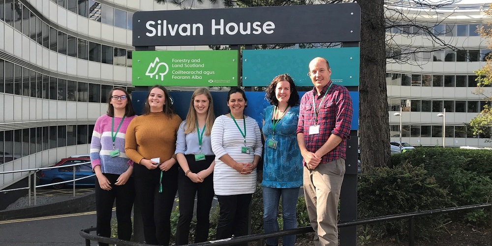 Apprentice staff outside Silvan House office building