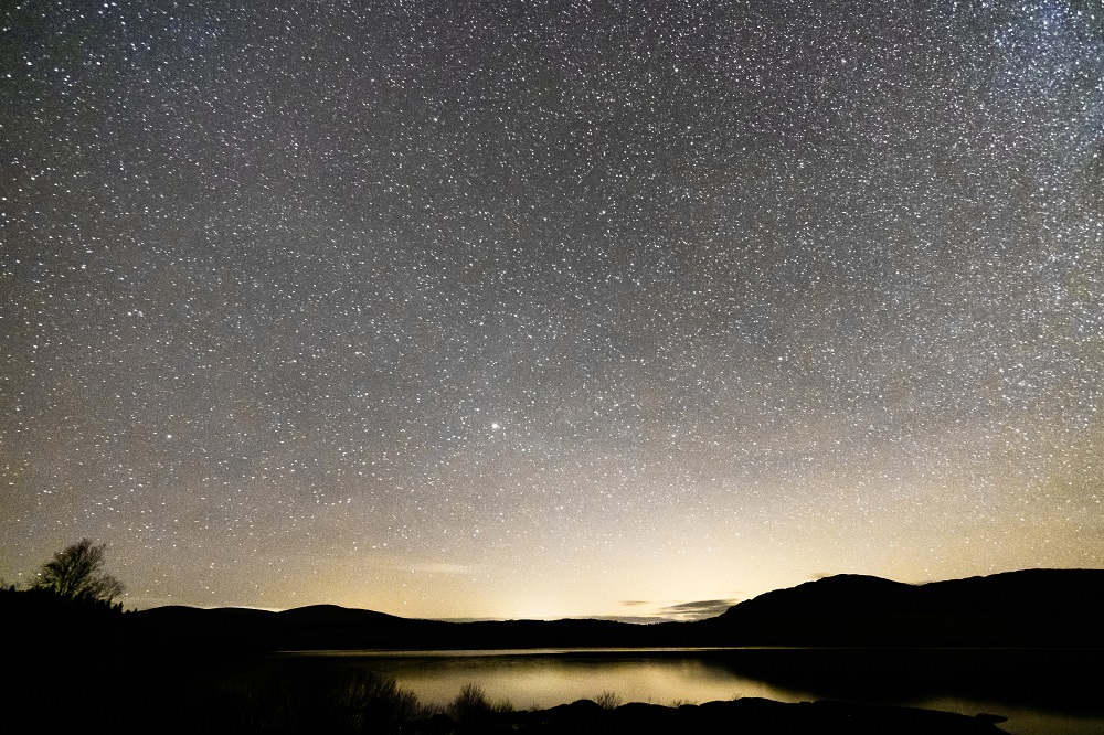 Clear, star lit skies above Clatteringshaws Loch