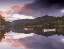 Two small boats on a calm loch