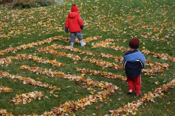 Two children in leaf maze