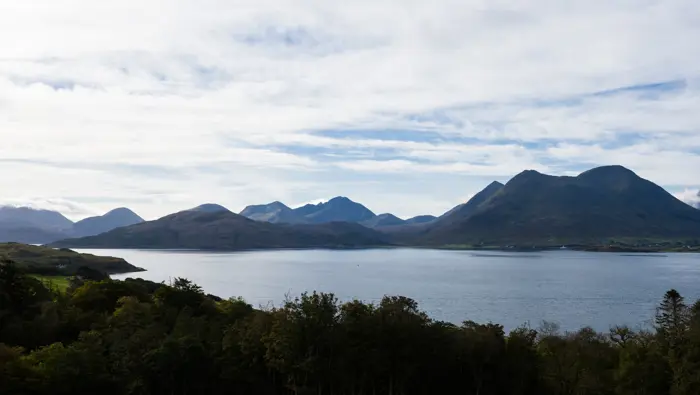 Mountains in the distance separated by water.