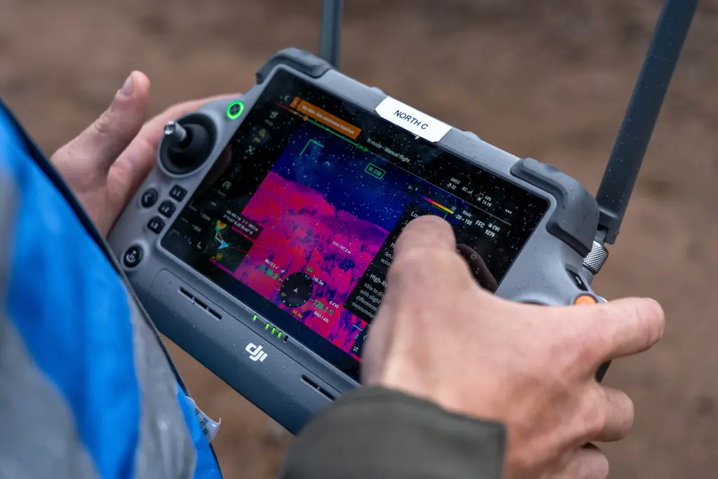Close up on drone controller showing thermal image.