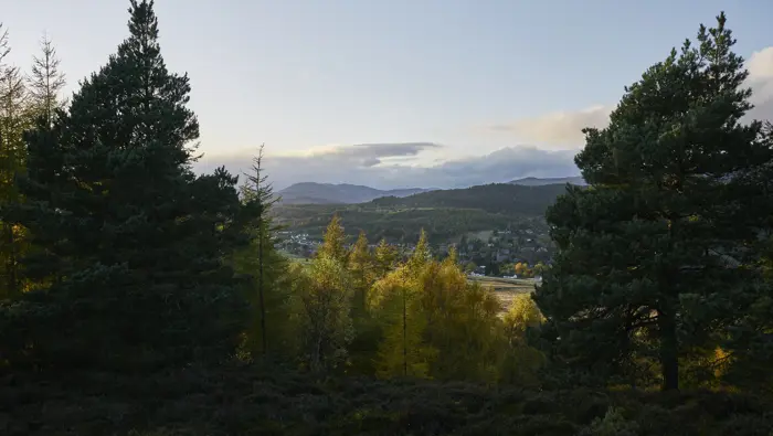 Hills in the distance with trees in the foreground.
