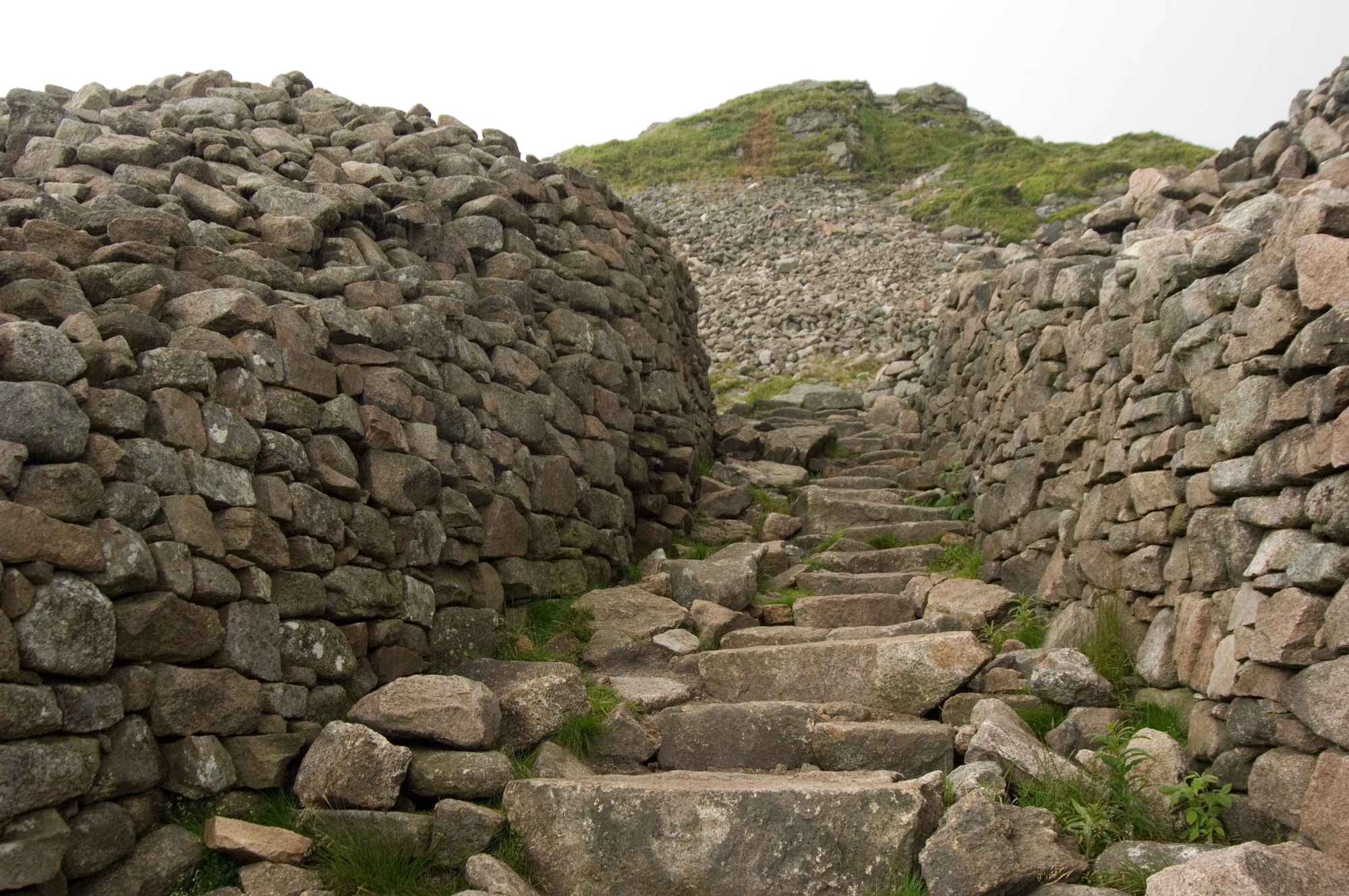 A stone fort and steps leading up to a hill