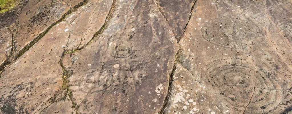 Rock art at Achnabreac showing repeating circles increasing in diameter as they go outwards across a rock.