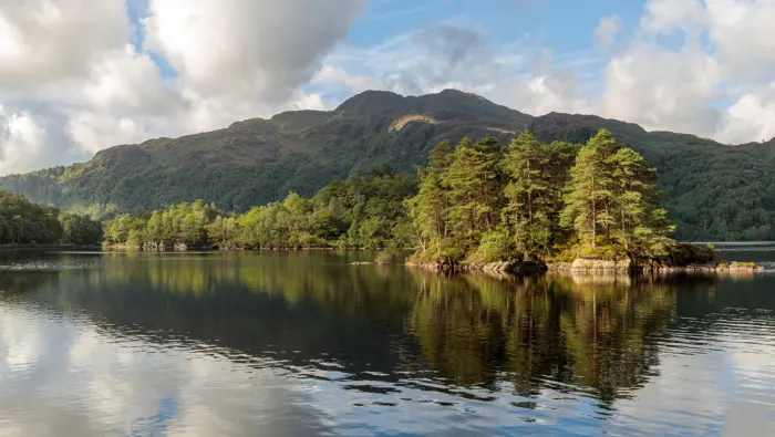 Loch with clouds reflected in the water.