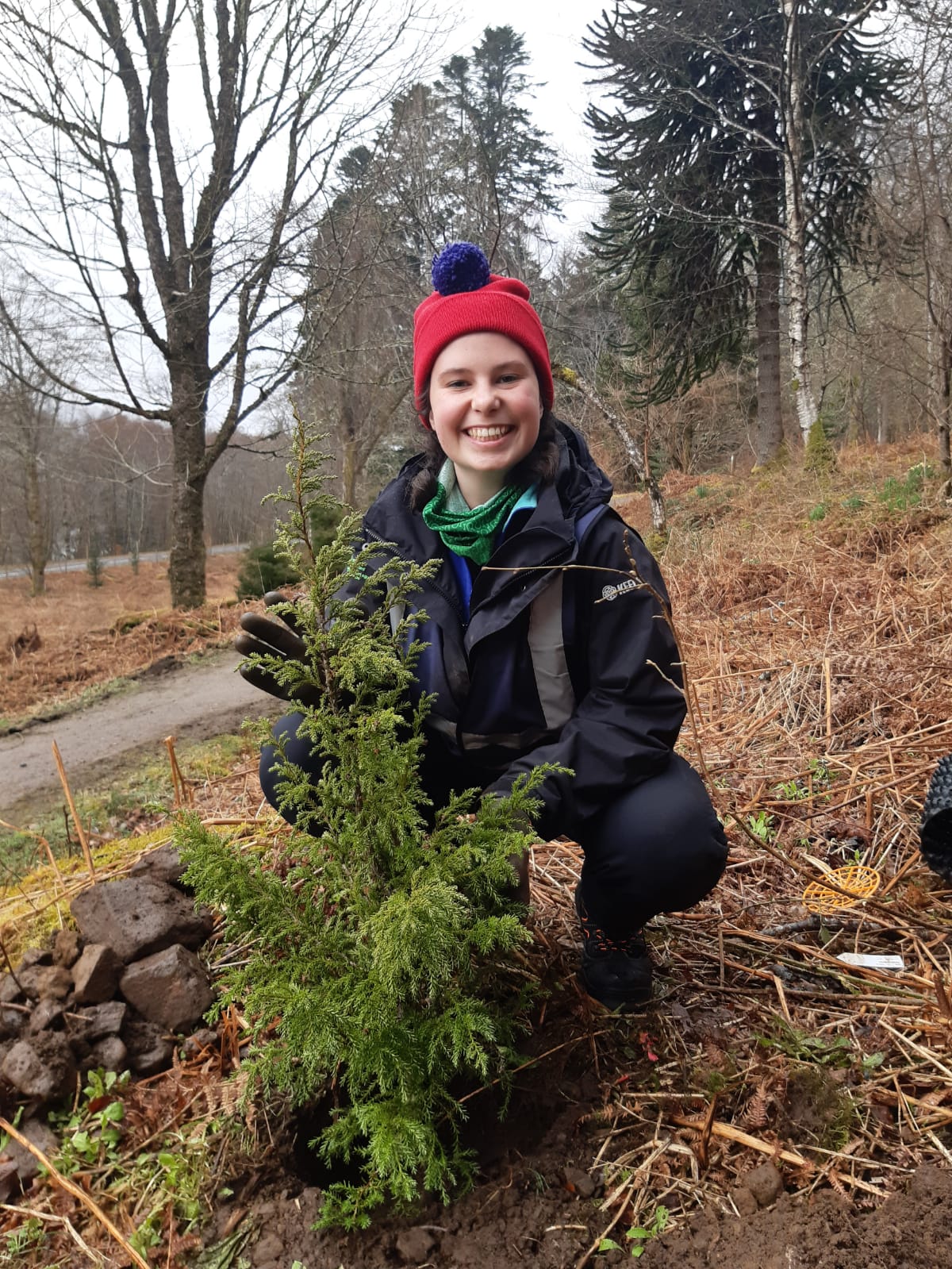 Female apprentice smiling at camera 