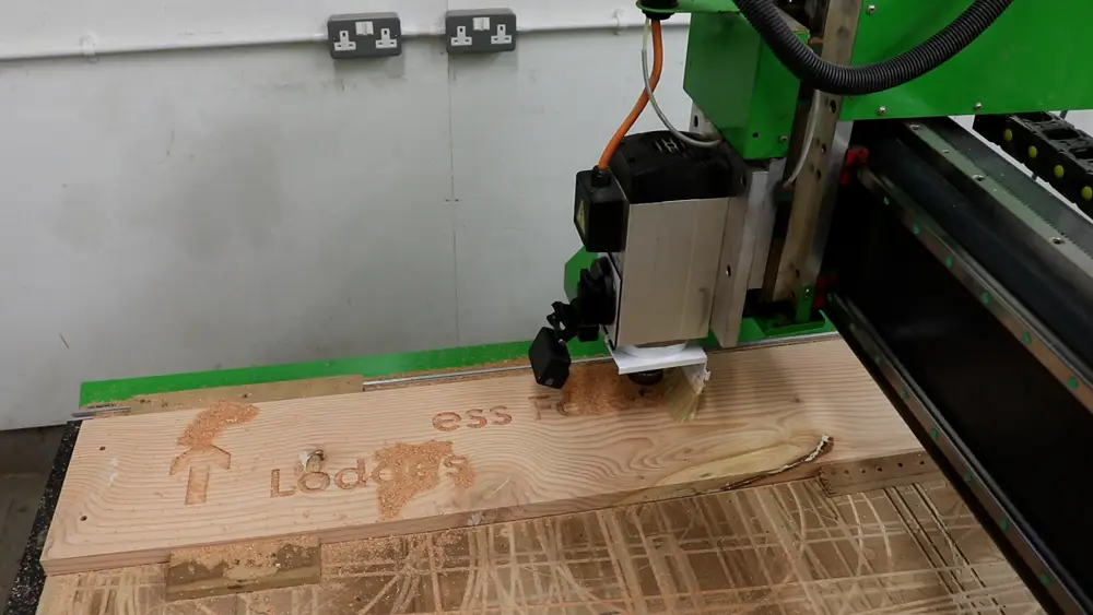 A sign being carved on a CNC machine