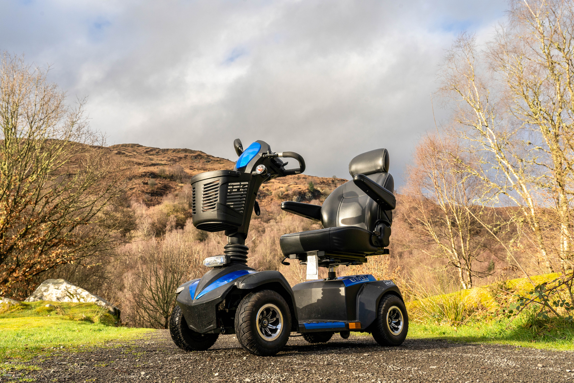 Mobility scooter on a gravel path.